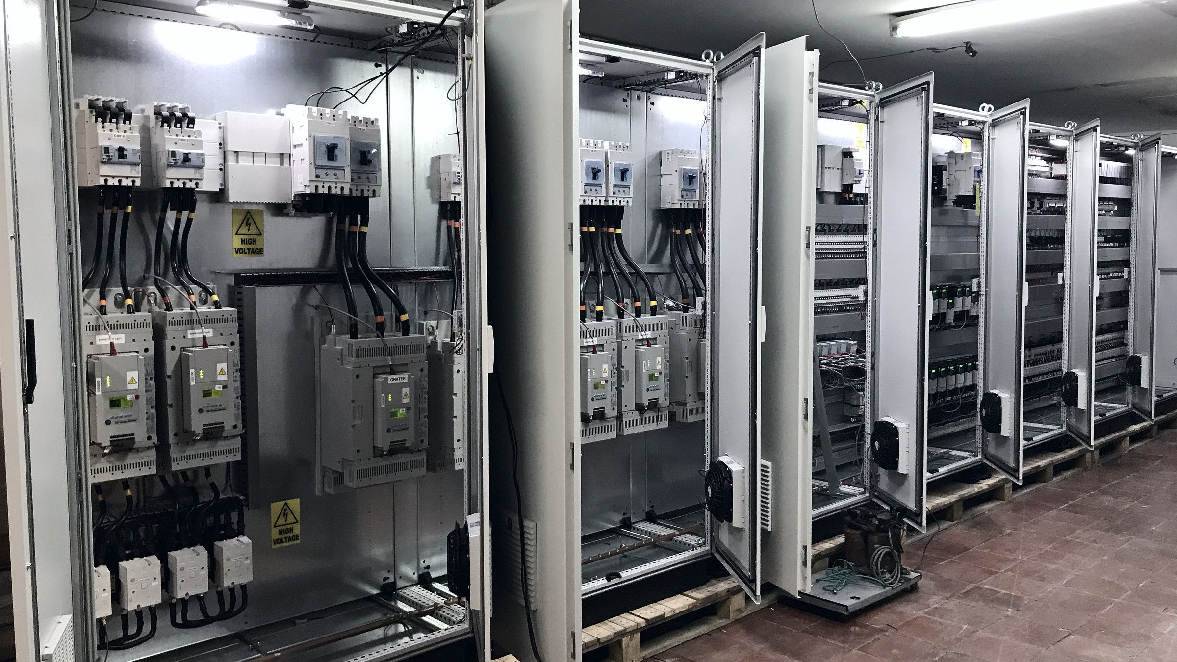 Row of open control cabinets for the China plant in the DDI workshop